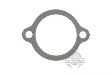 Gasket for engine housing breather valve